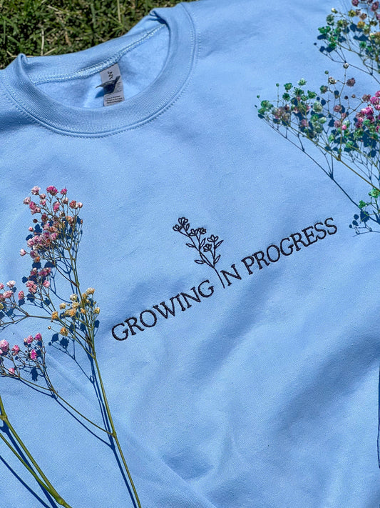 Growing in Progress Light Blue Embroidered Crewneck